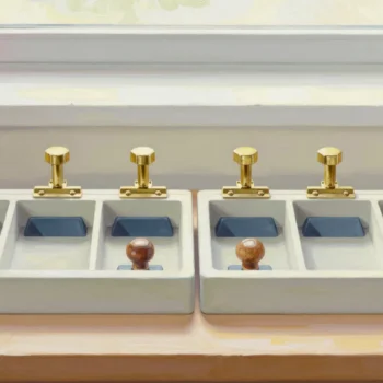 Matching brass fittings, blue wedges and wooden knobs align across two divided trays.