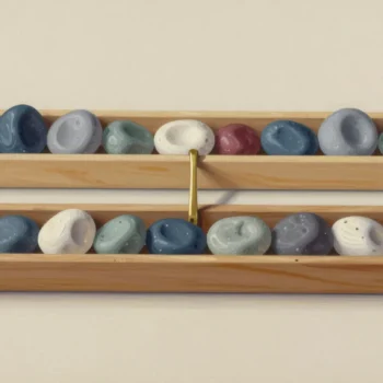 LAST_VALUE window frame illustration, two wooden trays holding smooth stones beside a brass divider.
