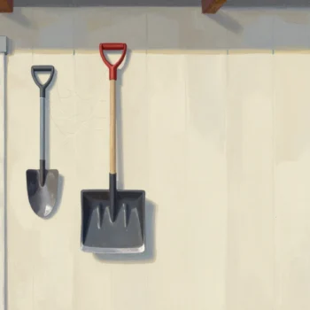 A dusty snow shovel hanging in a summer garden shed beside well-used trowels, early autumn leaves outside.