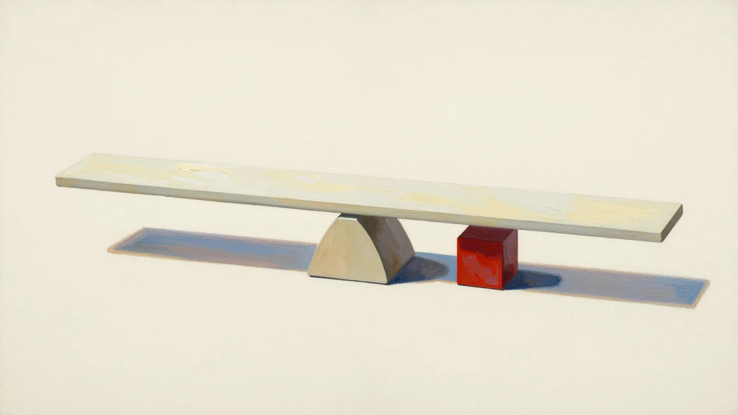 A long pale wooden plank over a triangular support, beside a red wooden cube.