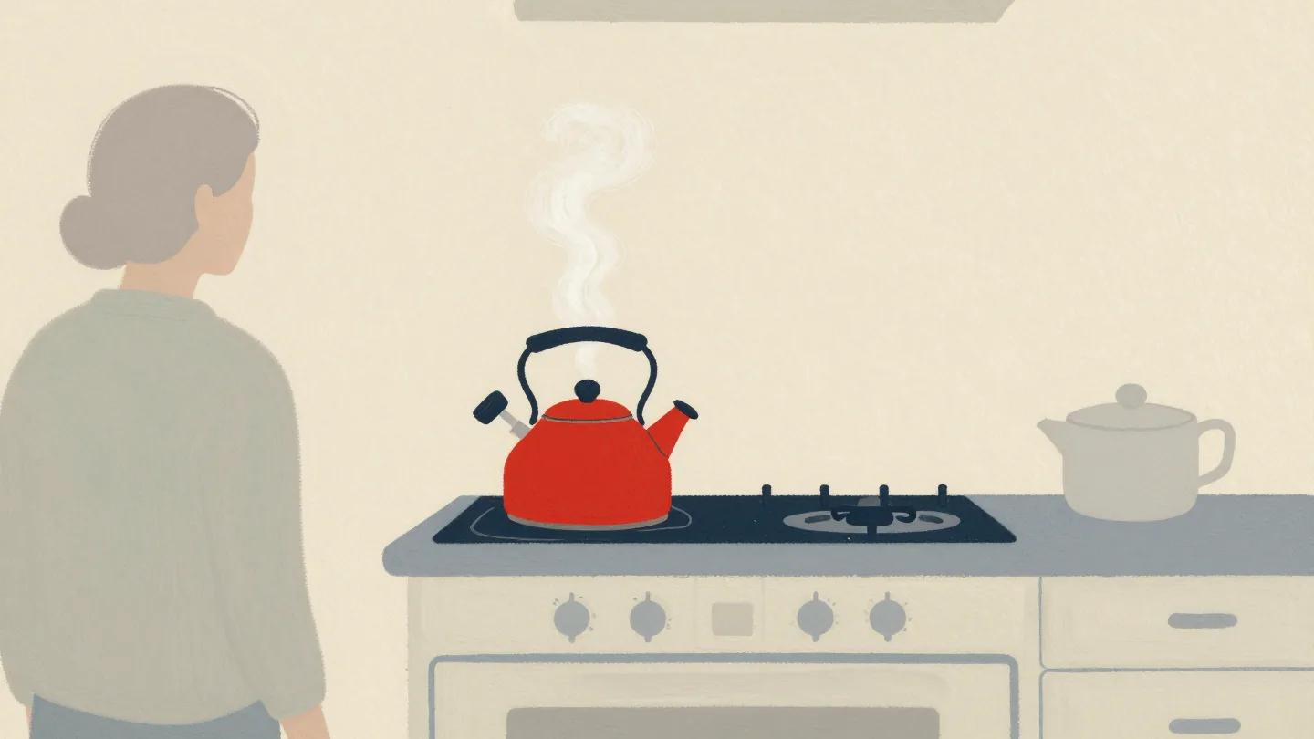 A red kettle whistling on the stove while someone in the next room turns to it