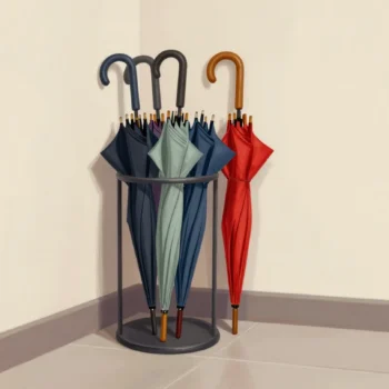 An overcrowded umbrella stand of cheap folding umbrellas squeezing out one worn red umbrella