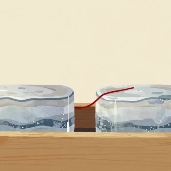 Two long layered ice cores side by side, a gloved hand stretching a red thread across both at the same band.