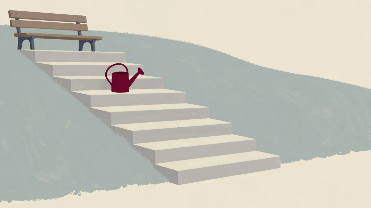Wide stone steps climbing a garden hillside toward a bench