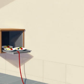 A hand pulling the rope of a dumbwaiter hatch as a tray of dishes arrives