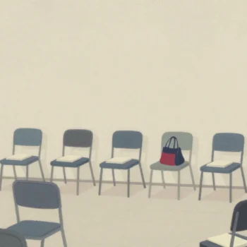 Gouache painting: a hall so full that spare chairs line the back wall, every chair holding a notebook and a cloth bag, one bag vermilion