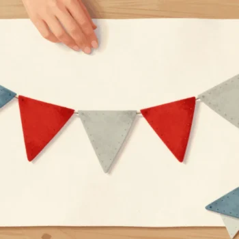 Hands sewing cloth bunting whose cord has run out, two red flags side by side.