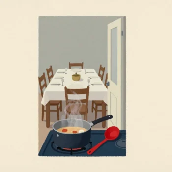 A small saucepan of stew on a stove, with a long dining table set for many guests visible through a doorway.