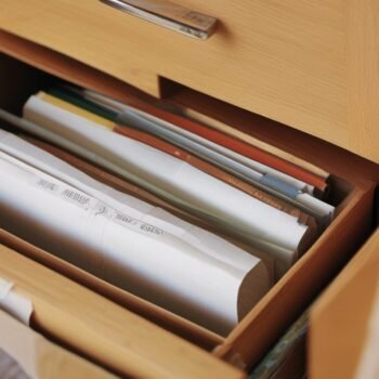 Open file drawer full of folders, a data source for reports