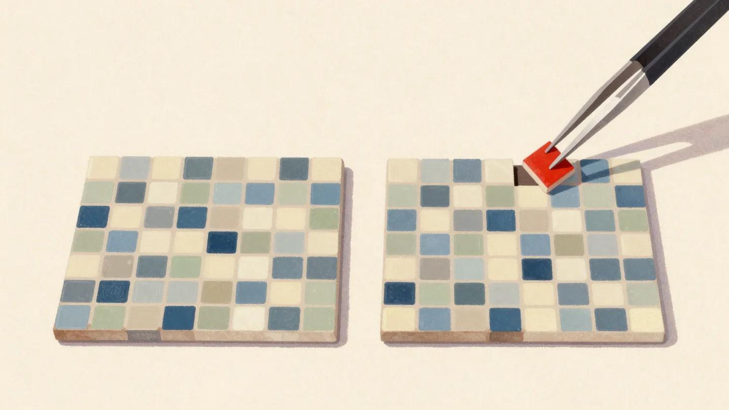 Two nearly matching tile mosaic panels side by side on a bench, tweezers holding one red tile