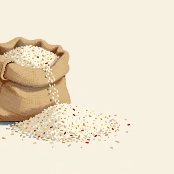 A rice sack leaking a thin trickle into a large heap, beside a smaller single spill of flour on a pantry floor.