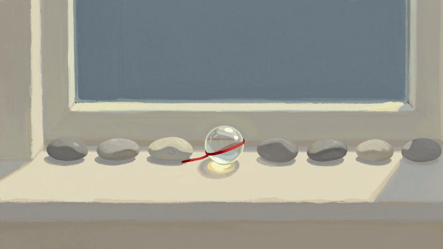 Gouache painting: a row of identical grey pebbles on a pale windowsill, one of them clear glass that catches the light, with a thin vermilion thread tied around it