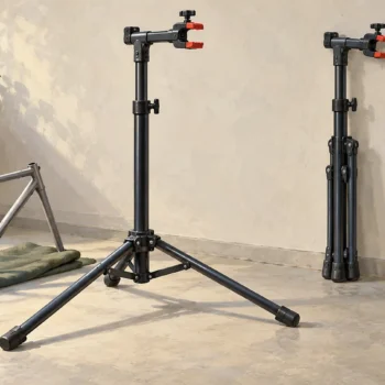 An empty extended bicycle repair stand takes more floor space than an identical folded stand