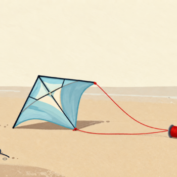 A grounded blue kite with a new cord and an old detached cord