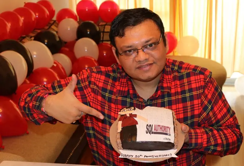 A man celebrating a 10th anniversary with a cake.
