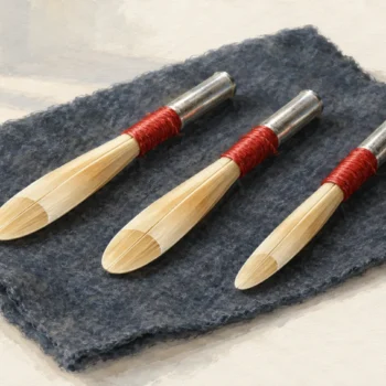 Three intact oboe reeds with one subtly different tip opening