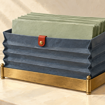 A fixed-base storage box has expanded sides to hold more sheets