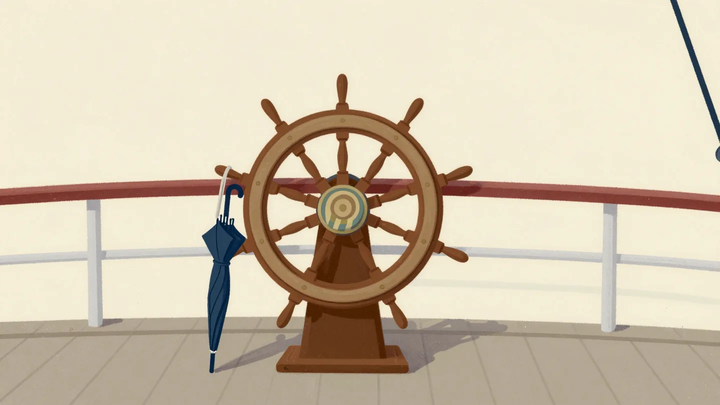 A polished wooden ship's wheel on an old ship's bridge with a child's swimming bag hanging from one spoke.