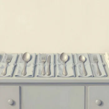 Seven cloth bundles of silverware on a sideboard, one opened and freshly polished beside a red tin.