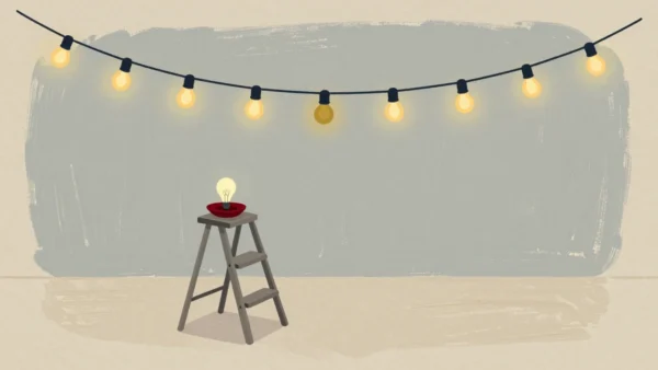 A string of glowing garden lights with one dark bulb, a replacement waiting on a stepladder.