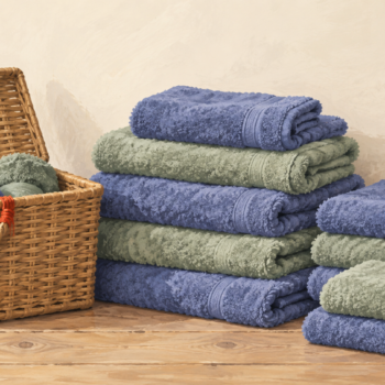 The actual collection of towels is larger than the small hamper suggested