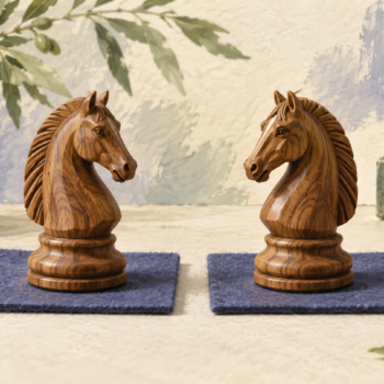 Two identical carved wooden knights show an original alongside its faithful duplicate