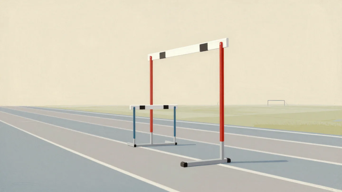A single lane of hurdles on a running track, each one higher than the last, the tallest one vermilion.