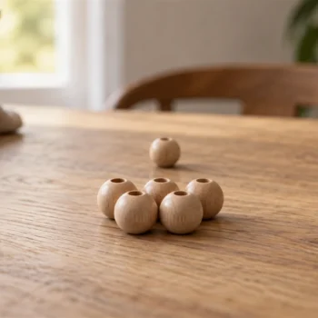 One small wooden bead resting behind a neatly arranged group of matching beads on a table.