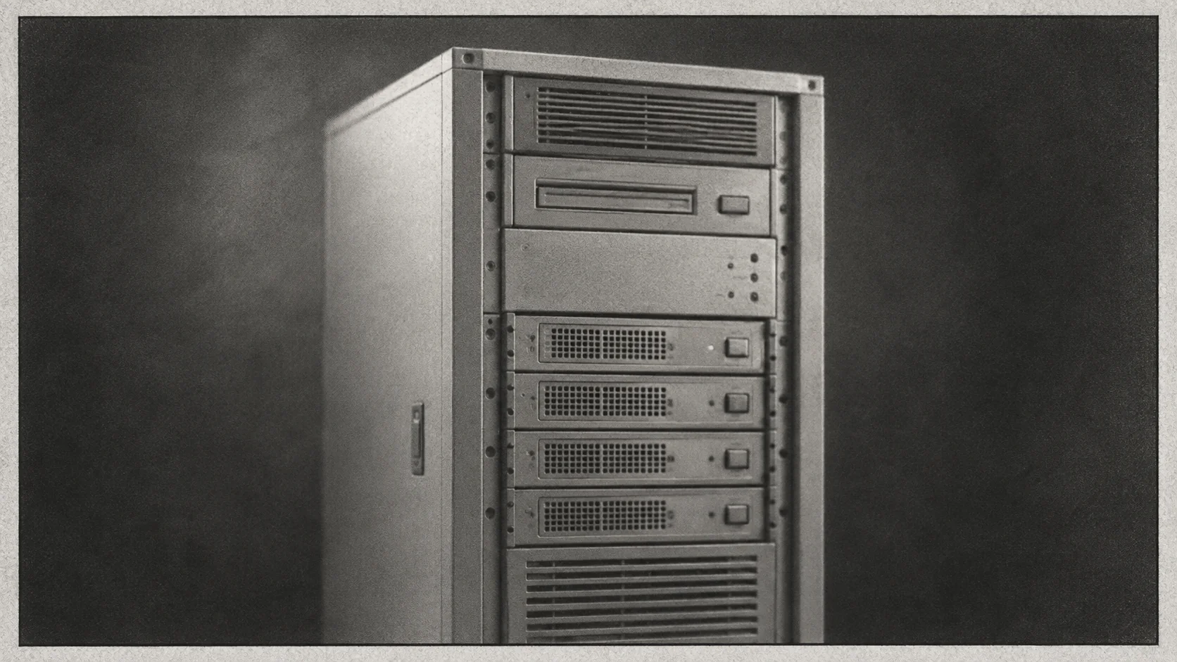 A newspaper obituary portrait in soft black and white of a server rack from the late 1990s, the kind the nightly index rebuild job was written for, slightly out of focus, with a small black border.