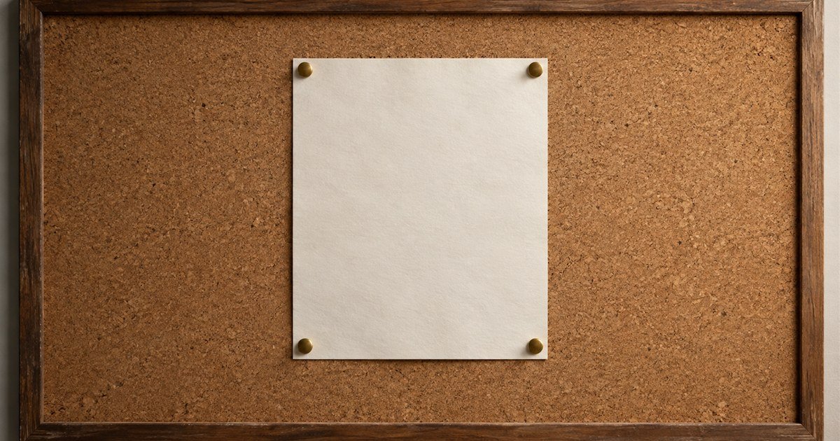 A single sheet pinned dead centre on an otherwise empty cork pinboard