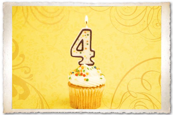 A cupcake with a number four candle.
