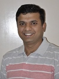 A man in a striped polo shirt.