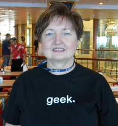 A woman wearing a black shirt with the word 'geek..