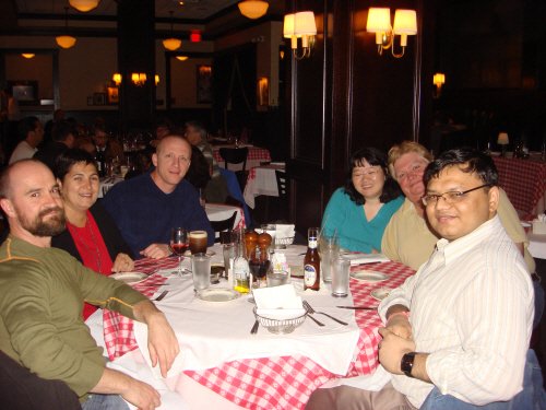 Group of people dining at a restaurant.