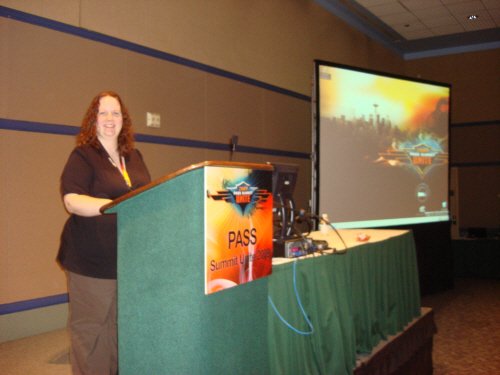 Woman presenting at sql pass summit.