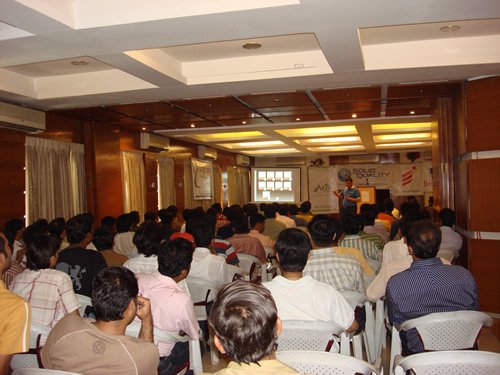 Individuals presenting at a conference.