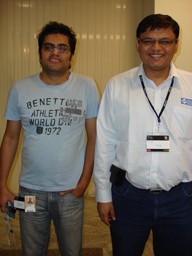 Two men posing for a photo at an event.