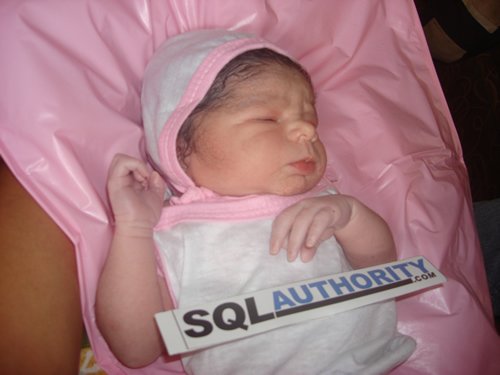 Newborn baby with 'SQLAuthority' sign.