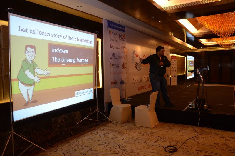 A man presenting at a conference.