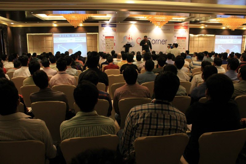 Conference attendees listening to a presenter.