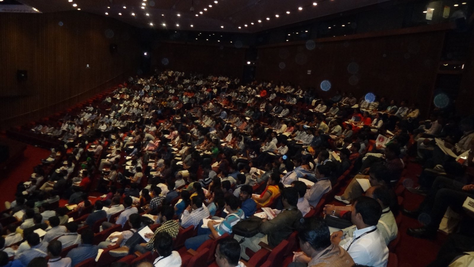A crowded auditorium at a conference.