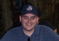 A man in a blue cap and shirt.