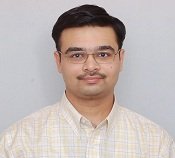 A man in glasses with a mustache.