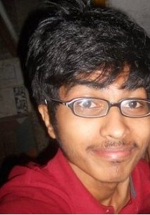 A man with glasses and a red shirt.