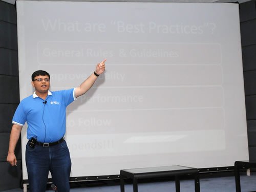 Man pointing at presentation slide.