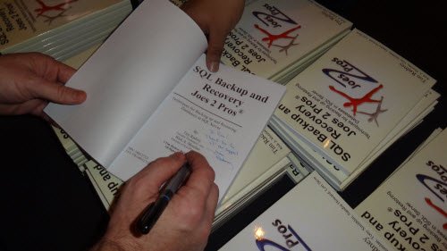 Hand signing book.