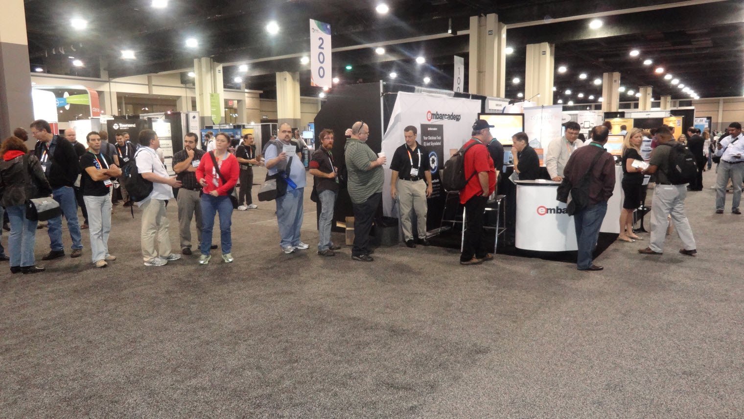 Conference attendees at a booth.
