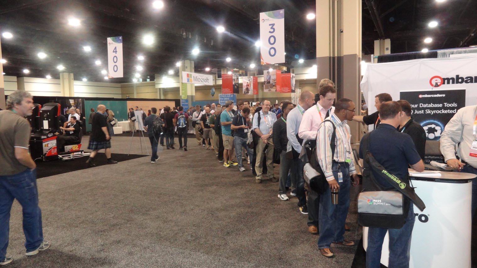 Queue of people at Microsoft booth.