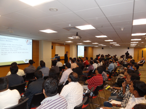 Conference attendees and speaker in presentation.