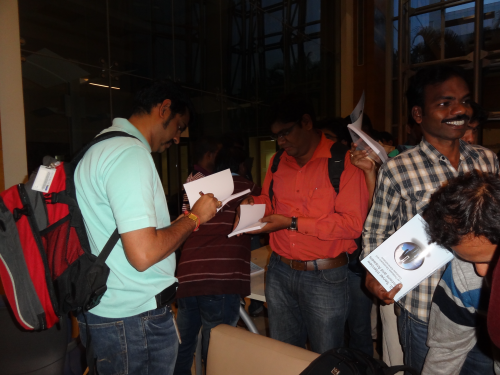 Group of people filling out forms.